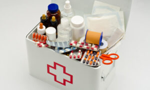 first-aid-box-open-filled-medical-supplies-white-background-43462848